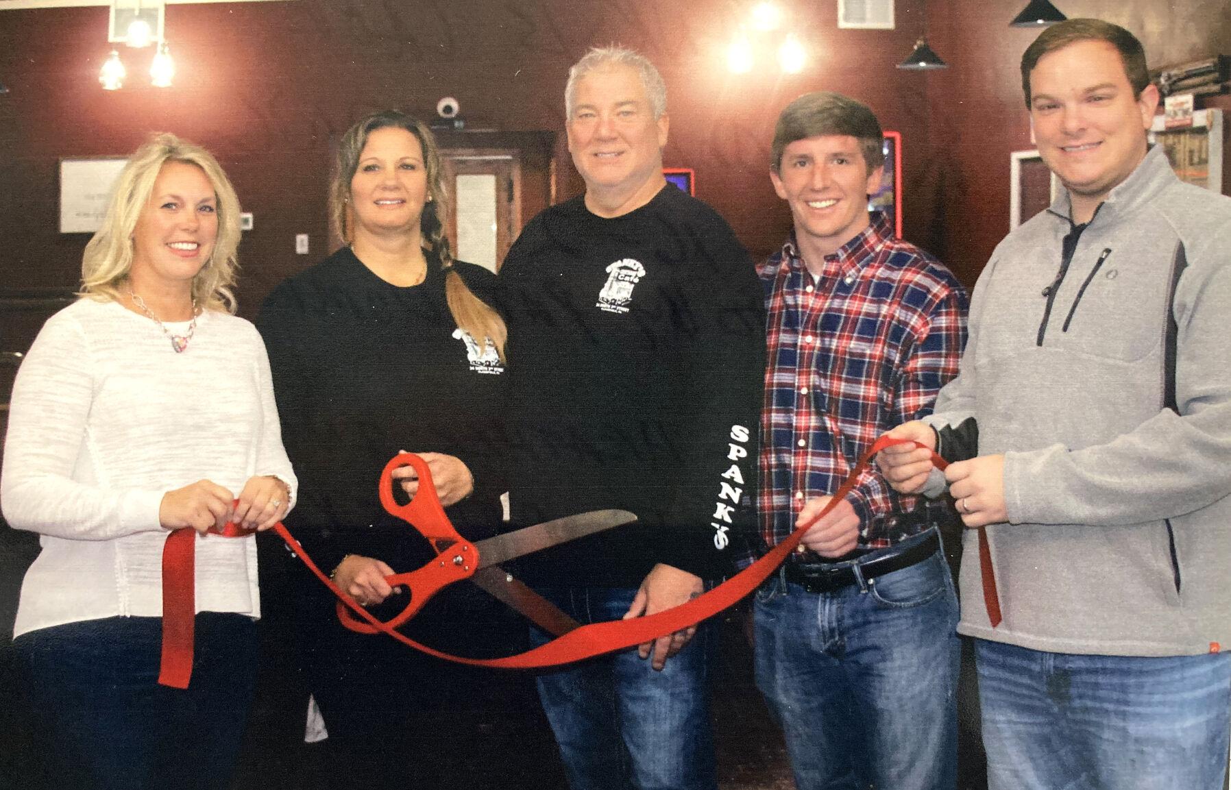 Owners cutting the ribbon.